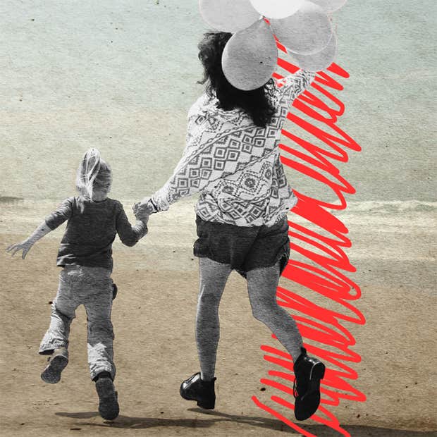 mom and daughter running on the beach