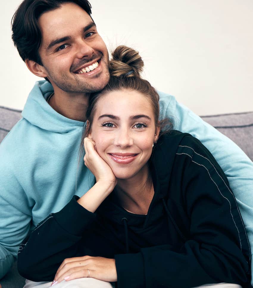 love and smile with a couple on a sofa in the living room