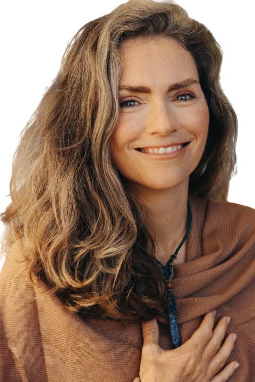 Confident woman smiling with calm presence, representing the transformation possible through self-love tools, nervous system healing, and expert guidance